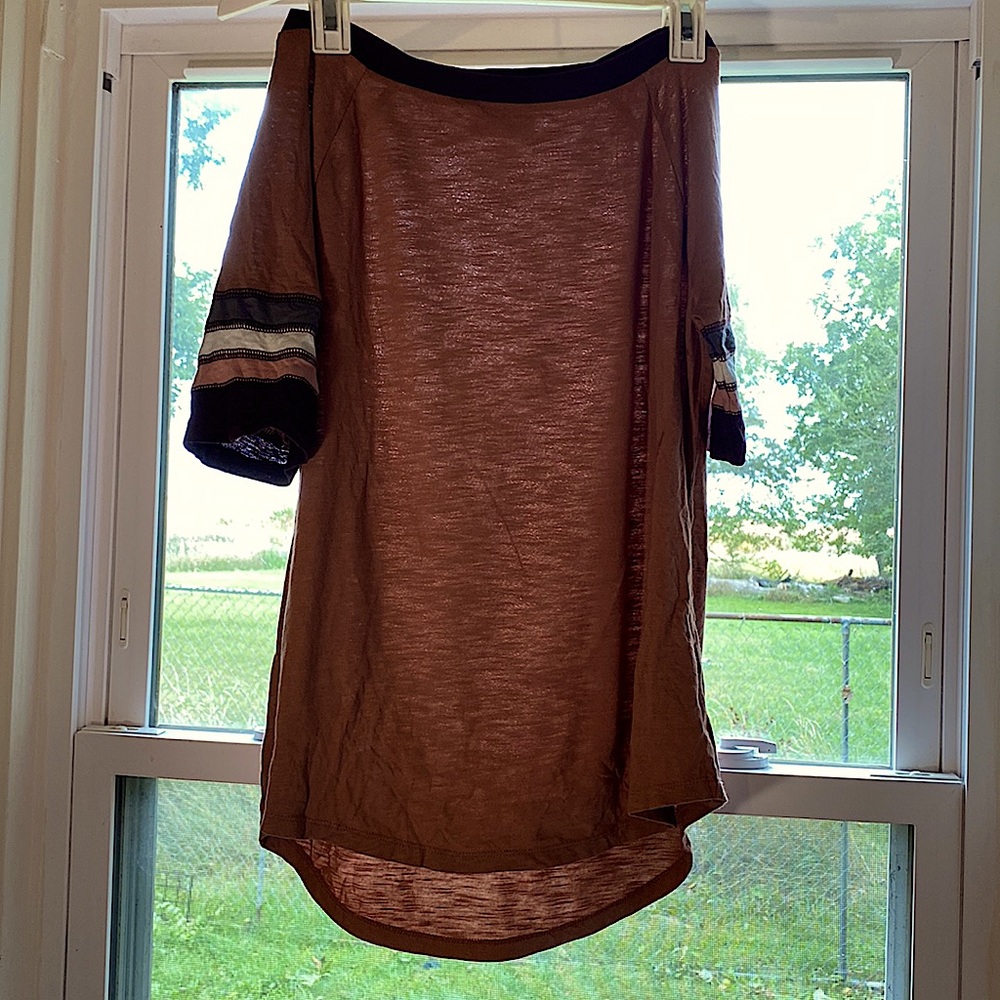 Extra small burgundy top with strips on the sleeves, and is cotton.